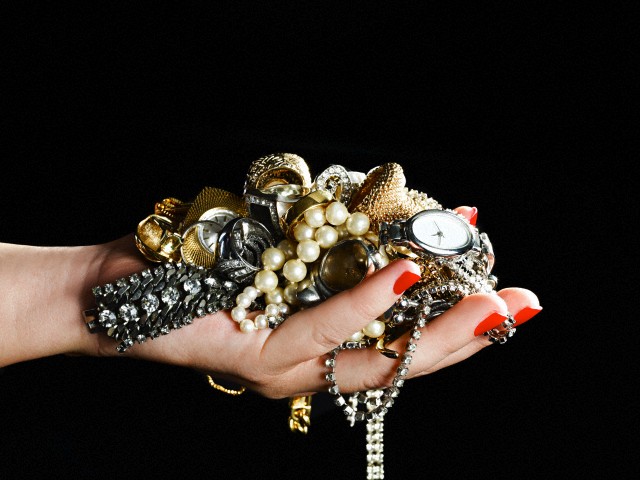 Woman holding jewelry
